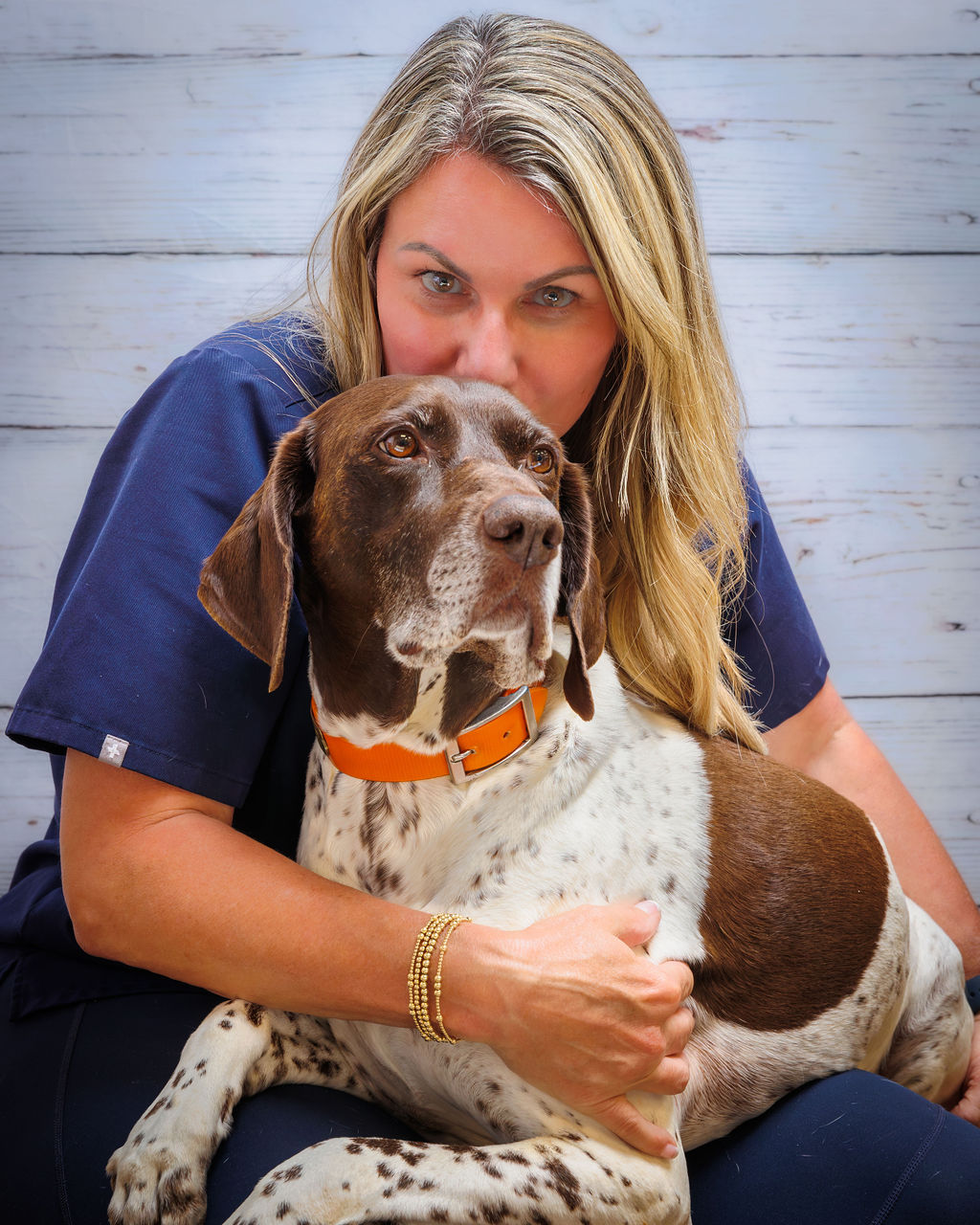Veterinarian Holding a Dog